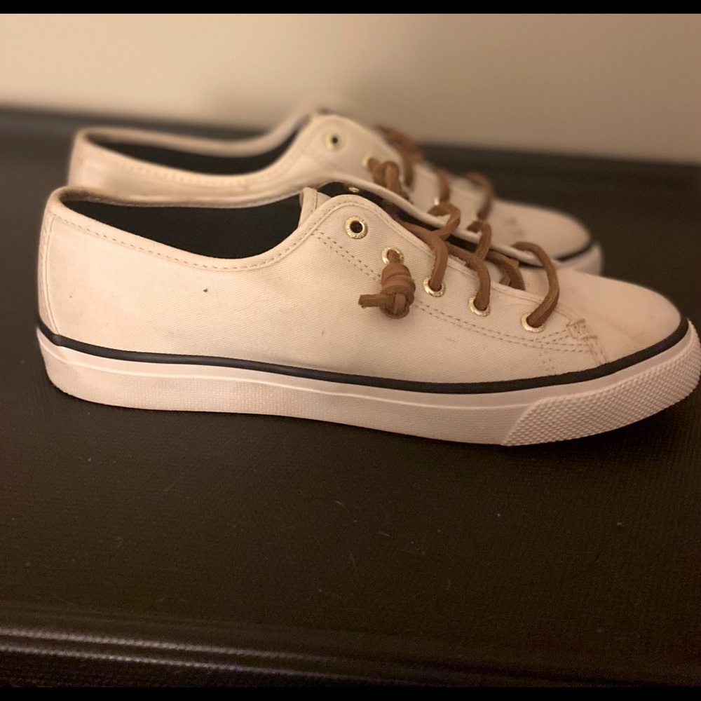 Sperry white canvas slip on shoes.